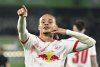 Leipzig's Xavi Simons celebrates scoring during the Bundesliga soccer match between VfL Wolfsburg and RB Leipzig at Volkswagen Arena, Wolfsburg, Germany, Friday April 11, 2025. (Swen Pf'rtner/dpa via AP)
