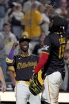 Pittsburgh Pirates' Andrew McCutchen, left, celebrates with Oneil Cruz, right, after defeating the Washington Nationals in a baseball game Monday, April 14, 2025, in Pittsburgh. (AP Photo/Matt Freed)