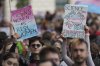 FILE - Campaigners take part in a rally organised by trans rights groups, trade unions, and community organisations following the Supreme Court ruling on the definition of a woman in equalities law, at Parliament Square, central London, Saturday April 19, 2025. (AP Photo/Alastair Grant, File)