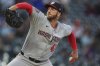 Washington Nationals relief pitcher Colin Poche works against the Colorado Rockies in the fifth inning of Game 2 of a split baseball doubleheader Sunday, April 20, 2025, in Denver. (AP Photo/David Zalubowski)