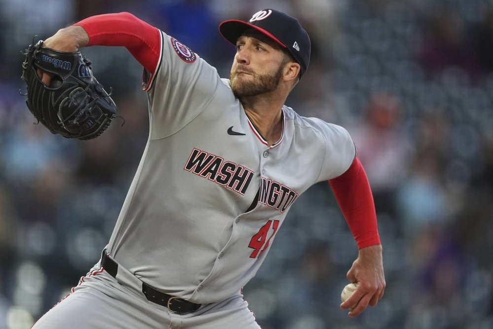 Washington Nationals relief pitcher Colin Poche works against the Colorado Rockies in the fifth inning of Game 2 of a split baseball doubleheader Sunday, April 20, 2025, in Denver. (AP Photo/David Zalubowski)
