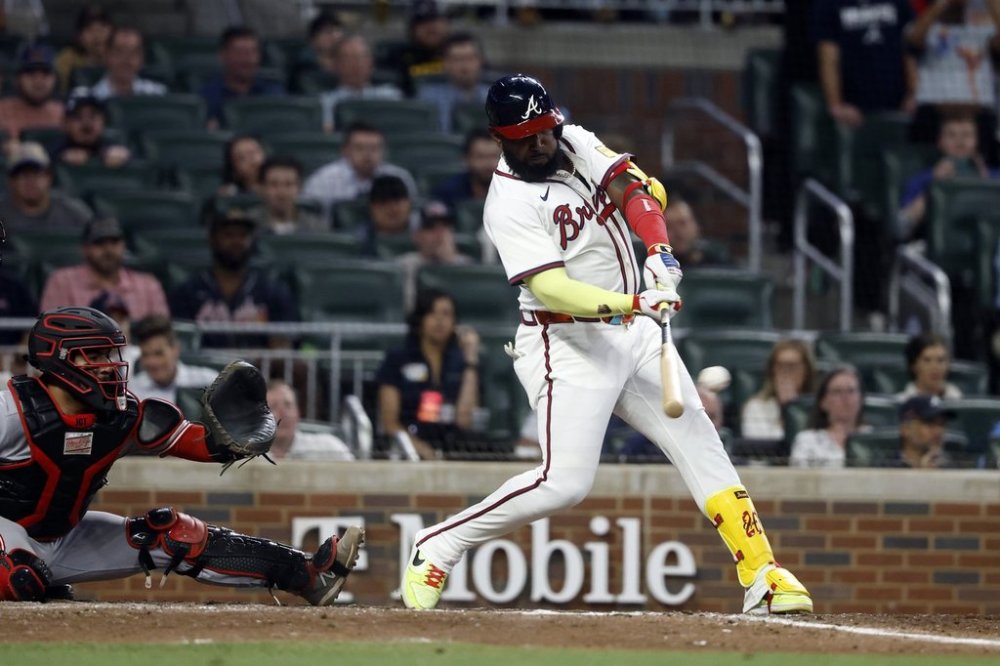 Atlanta Braves designated hitter Marcell Ozuna hits a walk off RBI during the 10th inning of a baseball game to beat the Cincinnati Reds, Tuesday, May 6, 2025, in Atlanta. (AP Photo/Butch Dill)