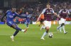 PSG's Ousmane Dembele, left, makes an attempt to score during the Champions League quarterfinal second leg soccer match between Aston Villa and Paris Saint-Germain at Villa Park stadium, Birmingham, England, Tuesday, April 15, 2025. (AP Photo/Kirsty Wigglesworth)