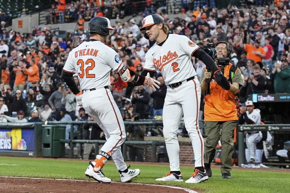 Baltimore Orioles' Ryan O'Hearn (32) celebrates with Gunnar Henderson (2) after hitting a three-run home run during the third inning of a baseball game against the Cleveland Guardians, Thursday, April 17, 2025, in Baltimore. (AP Photo/Stephanie Scarbrough)