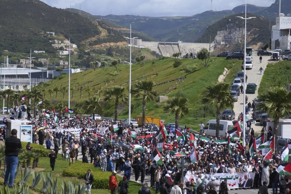 Moroccans protest the docking of a Maersk cargo ship carrying airplane parts they suspect are headed to Israel, outside Tangier Med Port, Sunday, April 20, 2025. (AP Photo/Mosa'ab Elshamy)