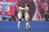Leipzig's Yussuf Poulsen, right, celebrates with Ridle Baku after scoring his side's third goal during the German Bundesliga soccer match between RB Leipzig and FC Bayern Munich at the Red Bull Arena in Leipzig, Germany, Saturday, May 3, 2025. (AP Photo/Matthias Schrader)