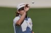 Cameron Smith, of Australia, catches a ball on the driving range during a practice round at the Masters golf tournament, Tuesday, April 8, 2025, in Augusta, Ga. (AP Photo/George Walker IV)