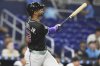 Arizona Diamondbacks' Lourdes Gurriel Jr. watches after hitting a two run home run during the eighth inning of a baseball game against the Miami Marlins, Wednesday, April 16, 2025, in Miami. (AP Photo/Lynne Sladky)