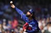 FILE - Los Angeles Dodgers starting pitcher Tony Gonsolin throws during the first inning of a spring training baseball game against the Chicago Cubs, Feb. 21, 2025, in Mesa. (AP Photo/Ashley Landis, File)