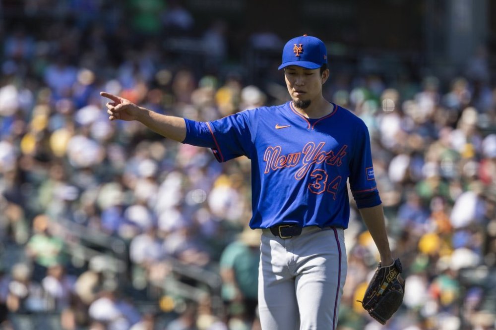 New York Mets pitcher Kodai Senga (34) walks to the dugout during the seventh inning of a baseball game Sunday, April 13, 2025, in West Sacramento, Calif. (AP Photo/Sara Nevis)