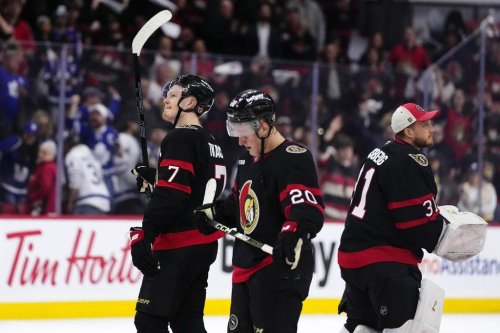 Ottawa Senators' Brady Tkachuk (7) raises his stick towards the fans as he skates off with Fabian Zetterlund (20) and goaltender Anton Forsberg (31) after the team's loss to the Toronto Maple Leafs and elimination from the NHL playoffs, in Ottawa, on Thursday, May 1, 2025. THE CANADIAN PRESS/Justin Tang