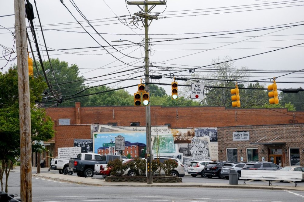 Utility poles and lines hang over downtown Mount Pleasant, N.C., on Thursday, April 24, 2025. (AP Photo/Nell Redmond)