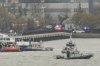 As seen from Pier 40 in New York, police and fire crews from New York and New Jersey respond to the scene Thursday, April 10, 2025, where a helicopter went down in the Hudson River between Manhattan and the New Jersey waterfront. (AP Photo/Yuki Iwamura)
