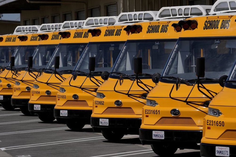 FILE - Zum electric buses are parked before a news conference announcing the Oakland Unified School District as being the first major school district in the country to use 100% electric school buses at the Zum/OUSD bus yard in Oakland, Calif., on Aug. 27, 2024. (AP Photo/Jeff Chiu, File)
