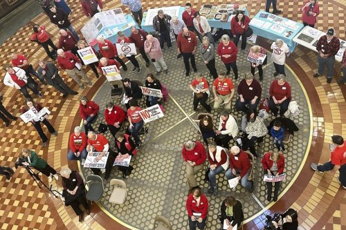 FILE - Opponents of Summit Carbon Solutions' proposed carbon dioxide pipeline gather at the state Capitol in Des Moines, Iowa, on Feb. 8, 2024. (AP Photo/Hannah Fingerhut, File)
