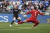 Arsenal's Alessia Russo scores her side's third goal during the women's Champions League semifinals, second leg, soccer match between Olympique Lyonnais and Arsenal at OL Stadium in Decines, outside Lyon, France, Sunday, April 27, 2025. (AP Photo/Thibault Camus)