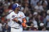 Houston Astros' Isaac Paredes watches his three-run home run during the second inning of a baseball game against the Los Angeles Angels, Sunday, April 13, 2025, in Houston. (AP Photo/Kevin M. Cox)