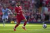 Liverpool's Mohamed Salah chases the ball during the English Premier League soccer match between Liverpool and Tottenham Hotspur at Anfield in Liverpool, England, Sunday, April 27, 2025. (AP Photo/Jon Super)