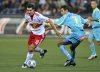 FILE - Salzburg's Nikola Pokrivac, left, and Sturm's Peter Hlinka challenge for the ball during the Austrian soccer league match between Red Bull Salzburg and Sturm Graz, in Salzburg, Austria, on Wednesday, Sept. 23, 2009. (AP Photo/Kerstin Joensson, file)
