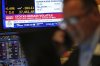 A television displays financial news on the floor at the New York Stock Exchange in New York, Wednesday, April 9, 2025. (AP Photo/Seth Wenig)
