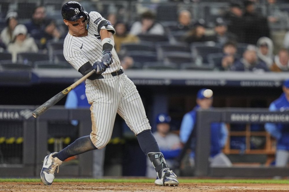 New York Yankees' Aaron Judge hits a home run during the seventh inning of a baseball game against the Kansas City Royals Wednesday, April 16, 2025, in New York. (AP Photo/Frank Franklin II)