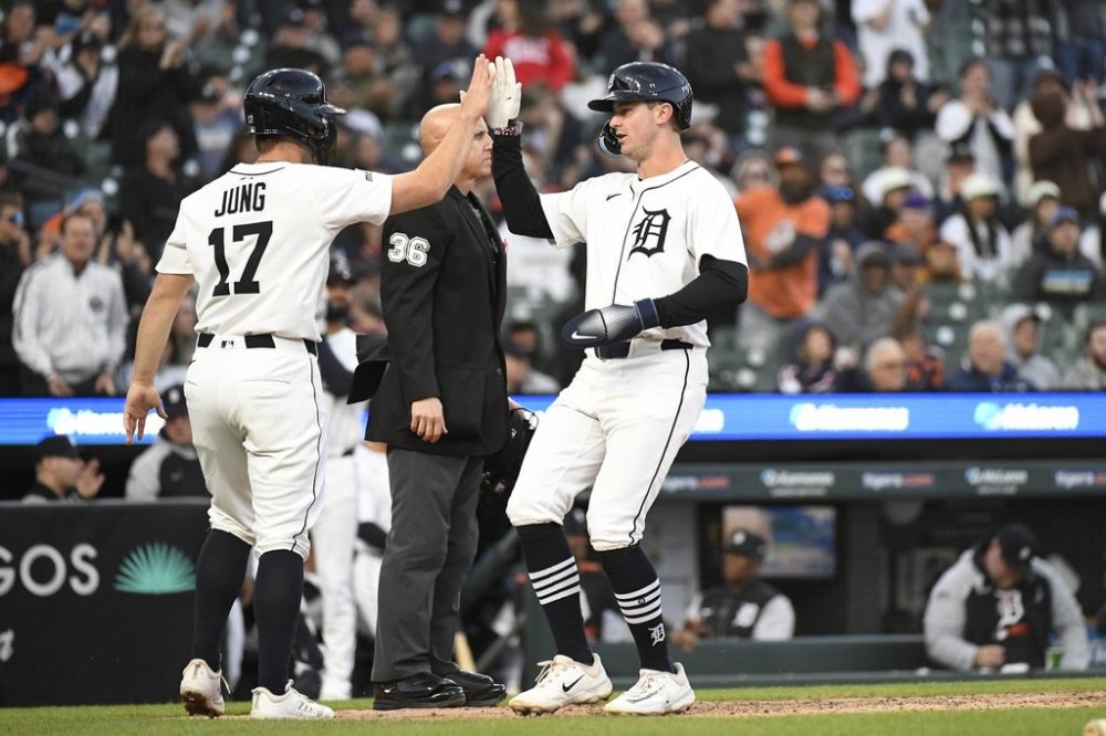 Detroit Tigers' Jace Jung (17) and Trey Sweeney, right, congratulate each other after they scored on an RBI single by Gleyber Torres during the third inning of a baseball game against the San Diego Padres, Monday, April 21, 2025, in Detroit. (AP Photo/Jose Juarez)