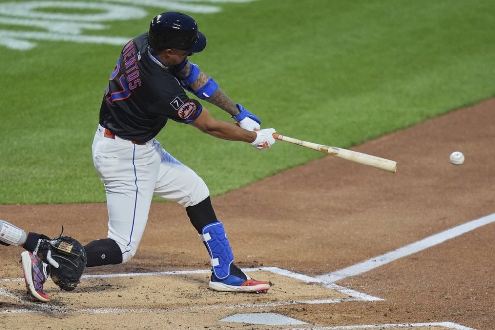 New York Mets' Mark Vientos (27) hits an RBI double during the second inning of a baseball game against the Philadelphia Phillies Tuesday, April 22, 2025, in New York. (AP Photo/Frank Franklin II)