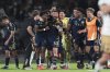 Members of the Vancouver Whitecaps celebrate at the end of a CONCACAF Champions Cup second-leg quarterfinal soccer match in Mexico Cityon Wednesday, April 9, 2025. (AP Photo/Eduardo Verdugo)