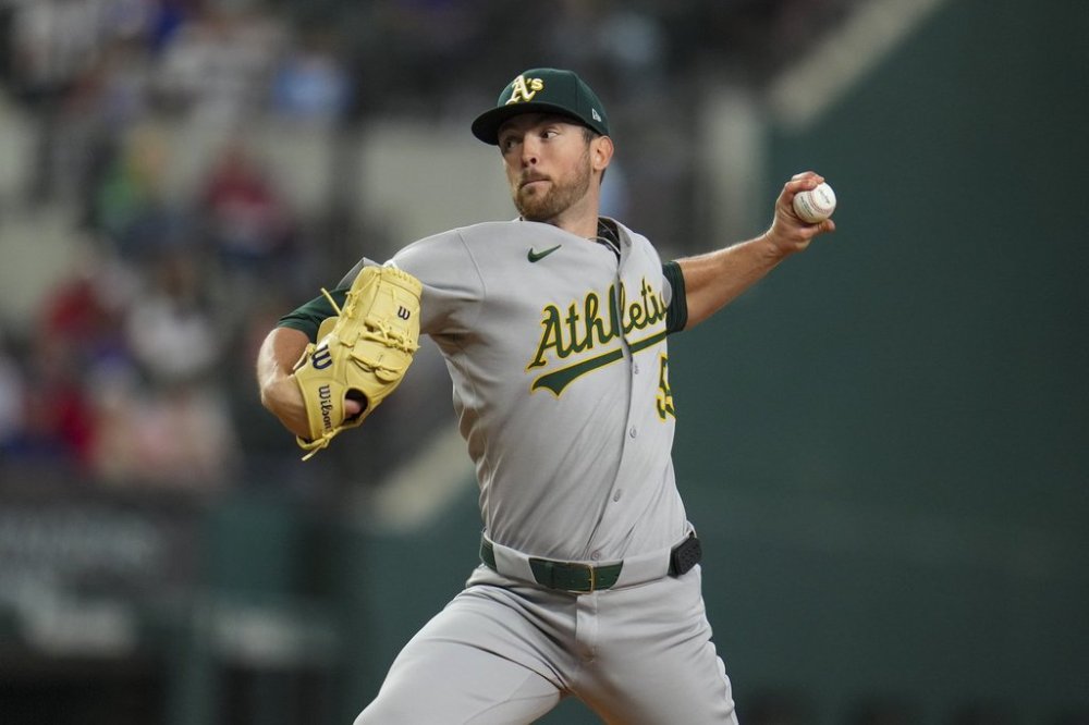 Oakland Athletics starting pitcher Jeffrey Springs throws a pitch to the Texas Rangers during the first inning of a baseball game Thursday, May 1, 2025, in Arlington, TX. (AP Photo/Julio Cortez)
