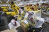 Robotic arms are shown stored at a Paslin facility Wednesday, April 23, 2025, in Warren, Mich. (AP Photo/Paul Sancya)