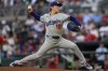 Los Angeles Dodgers pitcher Yoshinobu Yamamoto (18) works against the Atlanta Braves in the first inning of a baseball game, Friday, May 2, 2025, in Atlanta. (AP Photo/Mike Stewart)
