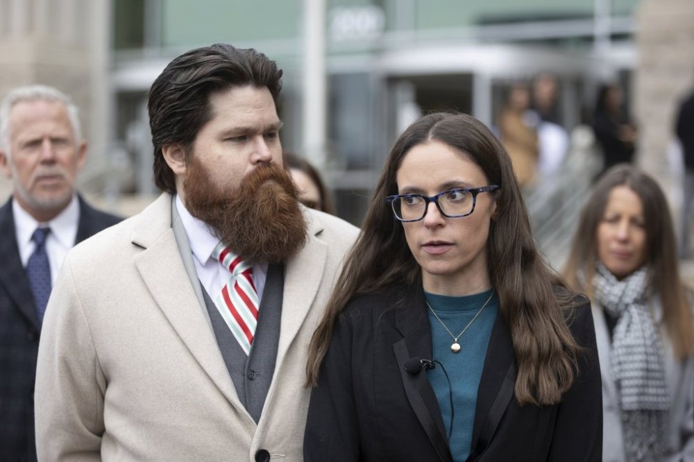 FILE - Jennifer Adkins and husband, John, from Caldwell, Idaho talk to the media outside the Ada County Courthouse, Dec. 14, 2023 in Boise, Idaho. (AP Photo/Kyle Green, File)