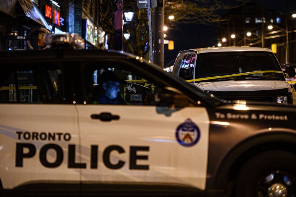 Police attend the scene of a collision in the west end of Toronto on Thurs., March 31, 2022. THE CANADIAN PRESS/Christopher Katsarov
