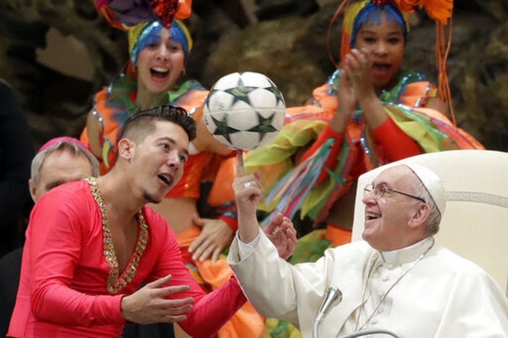 FILE - Pope Francis twirls a soccer ball he was presented by a member of the Circus of Cuba, during his weekly general audience in the Pope Paul VI hall, at the Vatican, Wednesday, Jan. 2, 2019. (AP Photo/Andrew Medichini, file)
