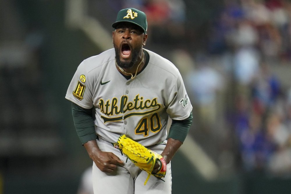 Oakland Athletics starting pitcher Luis Severino reacts after striking out Texas Rangers' Jake Burger with the bases loaded to end the third inning of a baseball game Wednesday, April 30, 2025, in Arlington, TX. (AP Photo/Julio Cortez)