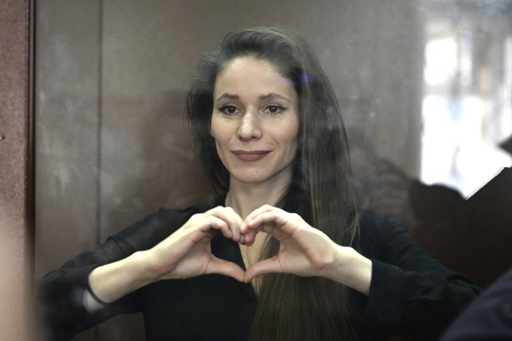 FILE - Antonina Favorskaya, accused of working for a group founded by the late Russian opposition politician Alexei Navalny, stands in a defendant's cage in the Basmanny District Court in Moscow, Russia, Friday, March 29, 2024. (AP Photo, File)
