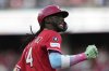 Cincinnati Reds' Elly De La Cruz reacts as he rounds the bases after hitting a grand slam home run to left center field in the third inning of a baseball game against the Pittsburgh Pirates, Saturday, April 12, 2025, in Cincinnati. (AP Photo/Carolyn Kaster)