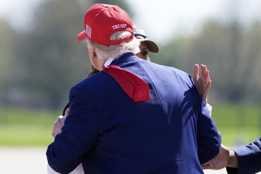 President Donald Trump greets Michigan Gov. Gretchen Whitmer as he arrives on Air Force One at Selfridge Air National Guard Base, Tuesday, April 29, 2025, in Harrison Township, Mich. (AP Photo/Alex Brandon)