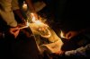 People burn Pakistani flags during a protest against the killing of tourists by militants near Pahalgam in Indian controlled Kashmir, in Guwahati, India, Thursday, April 24, 2025. (AP Photo/Anupam Nath)
