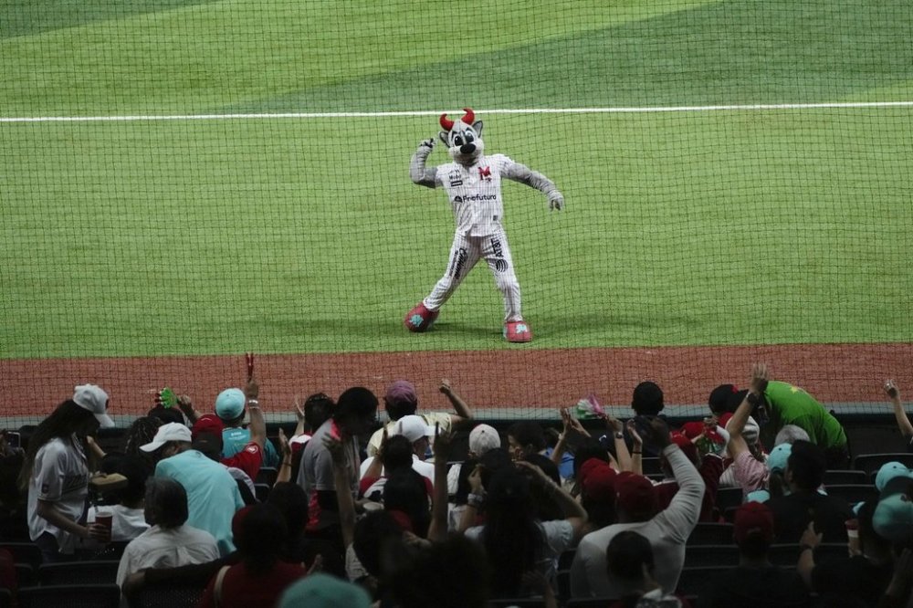 FILE- Rocco, the Diablos Rojo mascot, greets fans during a Mexican league baseball game against the Tigres of Quintana Roo, at the Alfredo Harp Helu Stadium in Mexico City, Tuesday, April 16, 2024. (AP Photo/Fernando Llano, file)