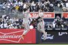 San Francisco Giants' Willy Adames, left, and Mike Yastrzemski, right, react after defeating the New York Yankees during a baseball game Sunday, April 13, 2025, in New York. (AP Photo/Pamela Smith)