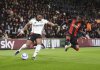 Fulham's Adama Traore, left, and Bournemouth's Dango Ouattara battle for the ball during the English Premier League soccer match between Bournemouth and Fulham at the Vitality Stadium, Bournemouth, England, Monday, April 14, 2025. (John Walton/PA via AP)