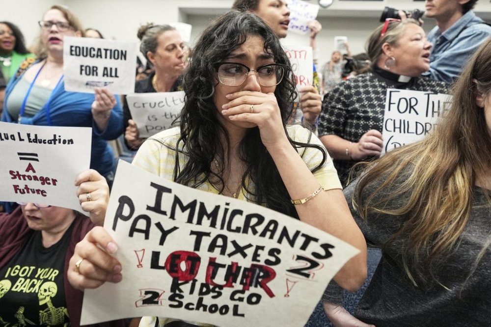 FILE - Micelle Beltran cries after a bill that would deny illegal immigrants access to education passed in a House Education Committee hearing in Nashville, Tenn., March 26, 2025. (AP Photo/George Walker IV, File)