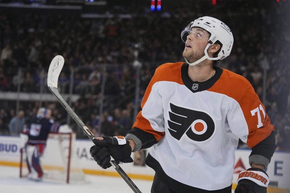 Philadelphia Flyers' Tyson Foerster (71) looks at the scoreboard after scoring a goal as he skates past New York Rangers goaltender Jonathan Quick during the second period of an NHL hockey game Wednesday, April 9, 2025, in New York. (AP Photo/Frank Franklin II)