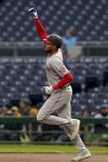 Washington Nationals outfielder James Wood rounds the bases after hitting a home run during the first inning of a baseball game against the Pittsburgh Pirates Tuesday, April 15, 2025, in Pittsburgh. (AP Photo/Matt Freed)