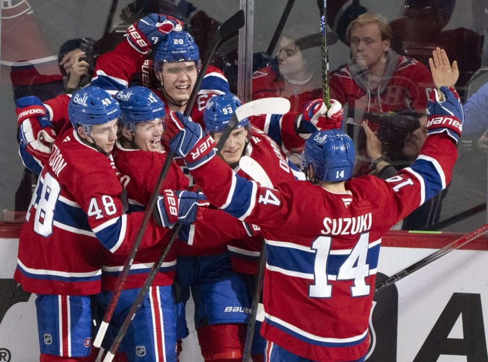 Montreal Canadiens' Juraj Slafkovsky (20) celebrates his goal over the Washington Capitals with teammates during second period NHL playoff action in Montreal on Sunday, April 27, 2025. THE CANADIAN PRESS/Christinne Muschi
