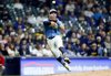 Milwaukee Brewers' Caleb Durbin cannot throw out Athletics' Miguel Andujar during the sixth inning of a baseball game, Friday, April 18, 2025, in Milwaukee. (AP Photo/Jeffrey Phelps)