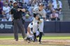 New York Yankees' Ben Rice, right, reacts after being hit by a pitch during the fourth inning of a baseball game against the Tampa Bay Rays, Saturday, April 19, 2025, in Tampa, Fla. (AP Photo/Mike Carlson)