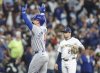 Chicago Cubs' Pete Crow-Armstrong, left, reacts after his three-run home run against the Milwaukee Brewers during the fourth inning of a baseball game, Saturday, May 3, 2025, in Milwaukee. (AP Photo/Jeffrey Phelps)