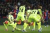 Barcelona's Dani Olmo, second left, scores his side's opening goal during a Spanish La Liga soccer match between Barcelona and Mallorca at the Lluis Companys Olympic stadium in Barcelona, Spain, Tuesday, April 22, 2025. (AP Photo/Joan Monfort)
